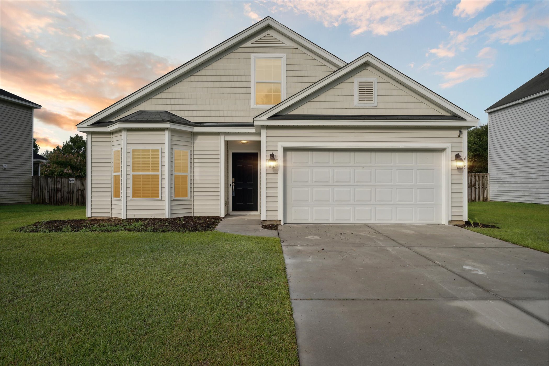 Front of 445 Lions Den Dr after updates, showing the house, garage and driveway