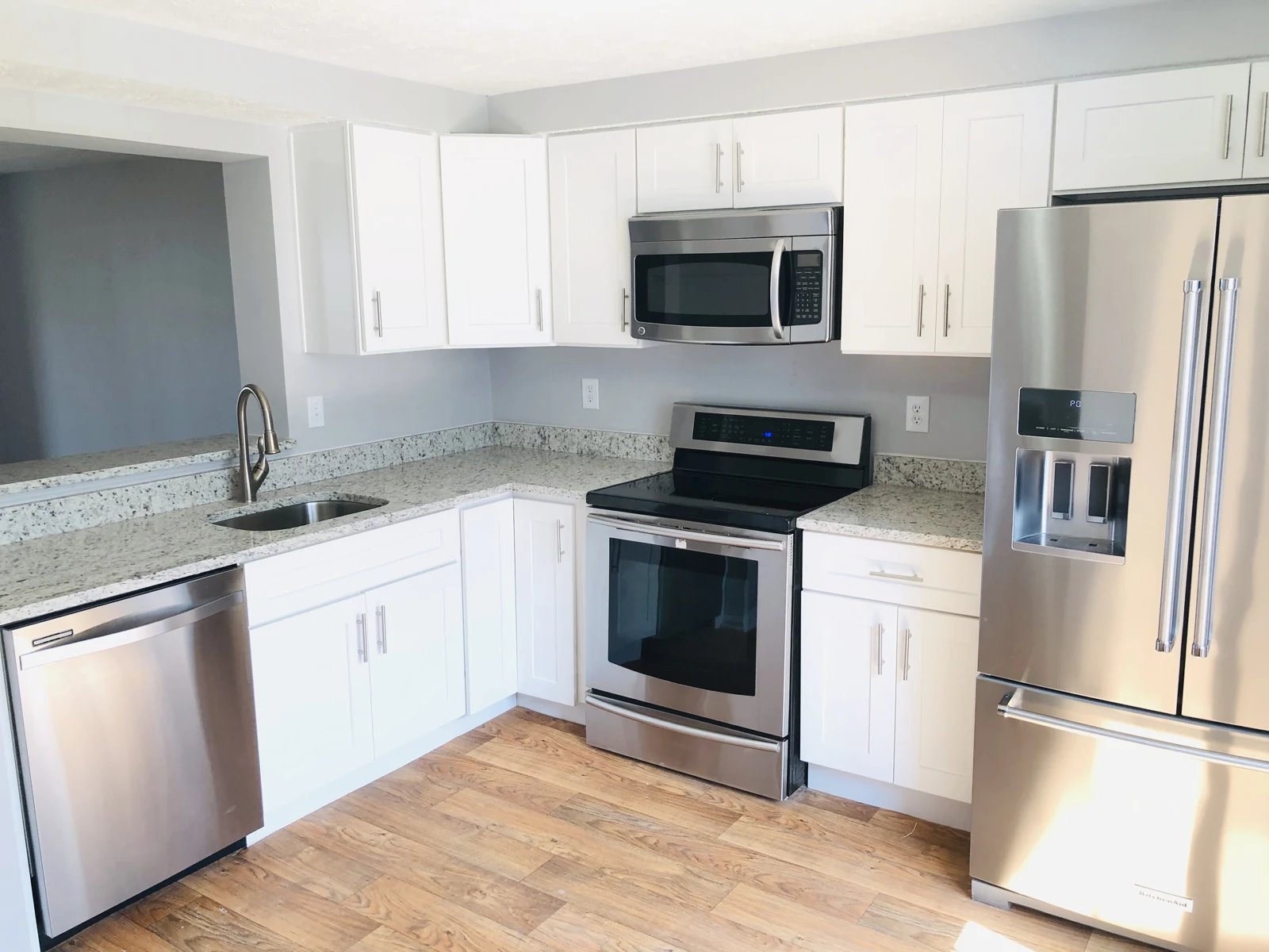 Kitchen with white cabinets and stainless appliances at 14602 Olde Kent Road