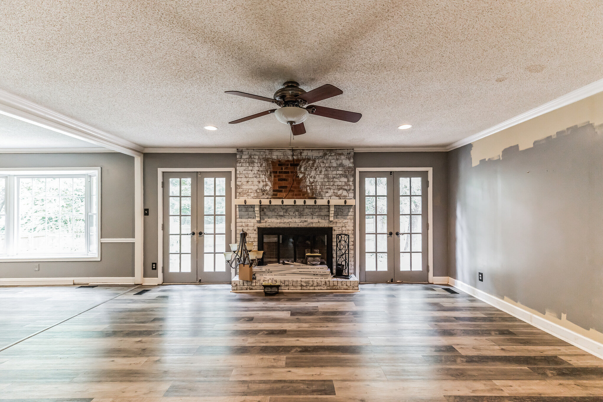 Stone fireplace and living room at 2002 Pinewood Terrace in later property photos