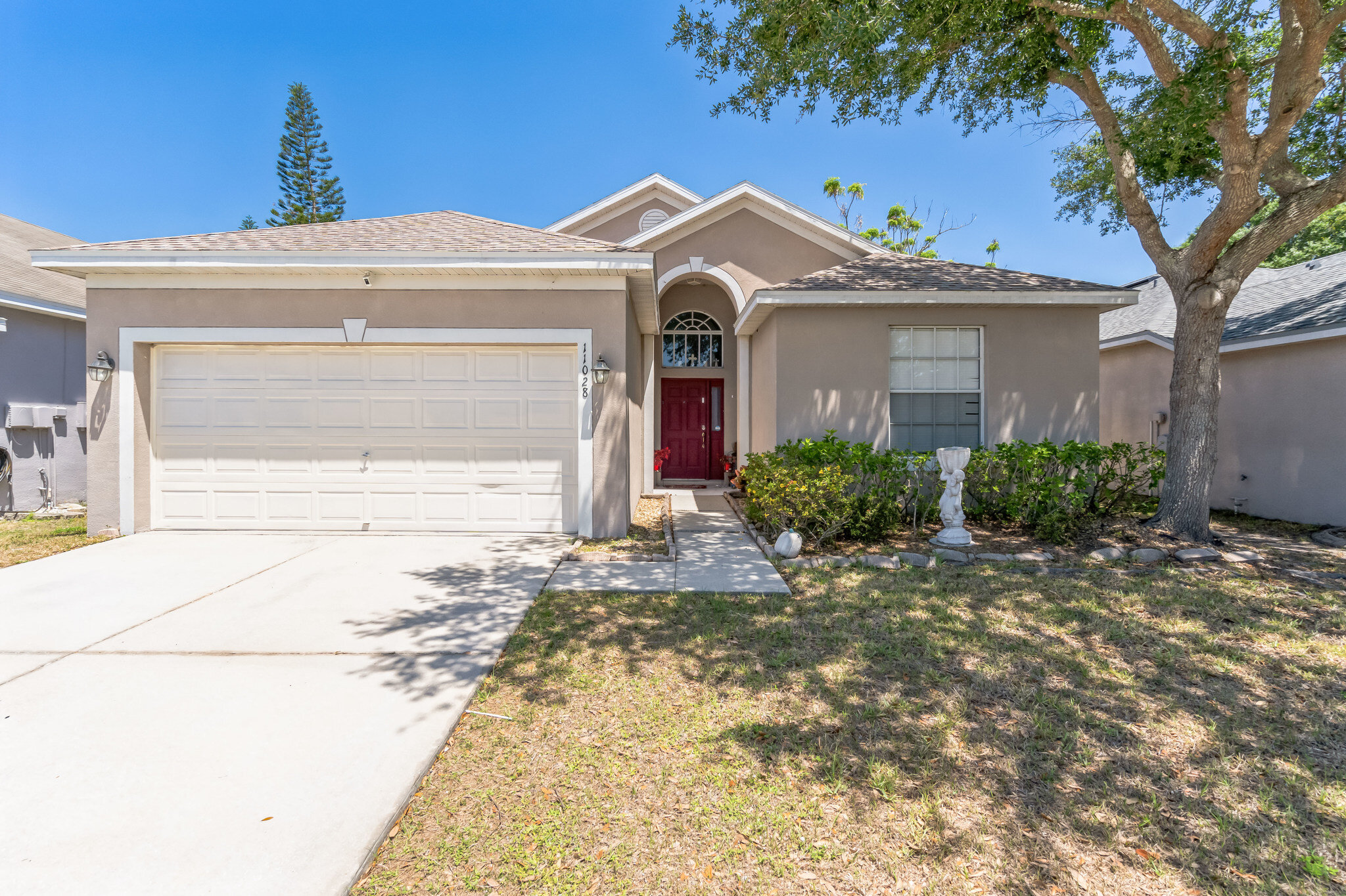 Front exterior and garage at 11028 Silver Dancer Dr in Riverview