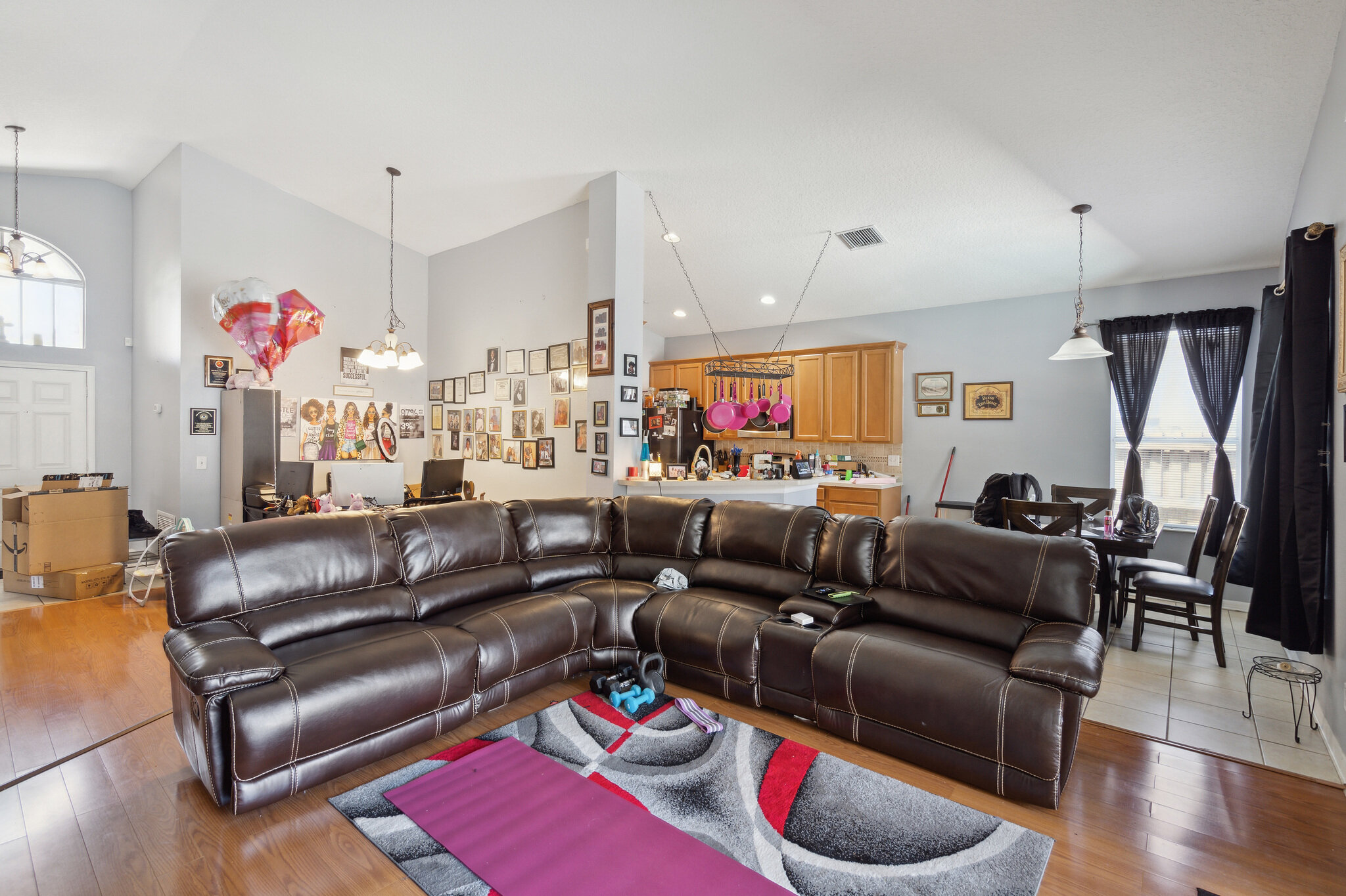 Living room opening to the kitchen at 11028 Silver Dancer Dr in Riverview