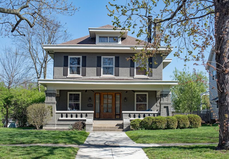 a large house with an open porch that the owner wants to sell to downsize