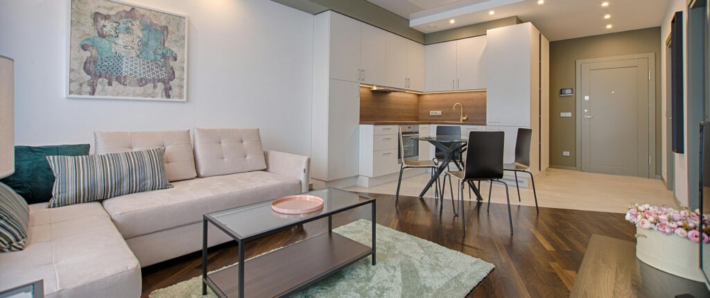 Staged living room in Houston home showing natural light and open space for a faster home sale with FIT Acquisitions.