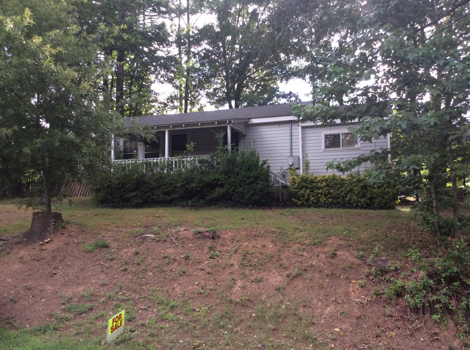 gray house with for sale sign out front East Cobb, GA