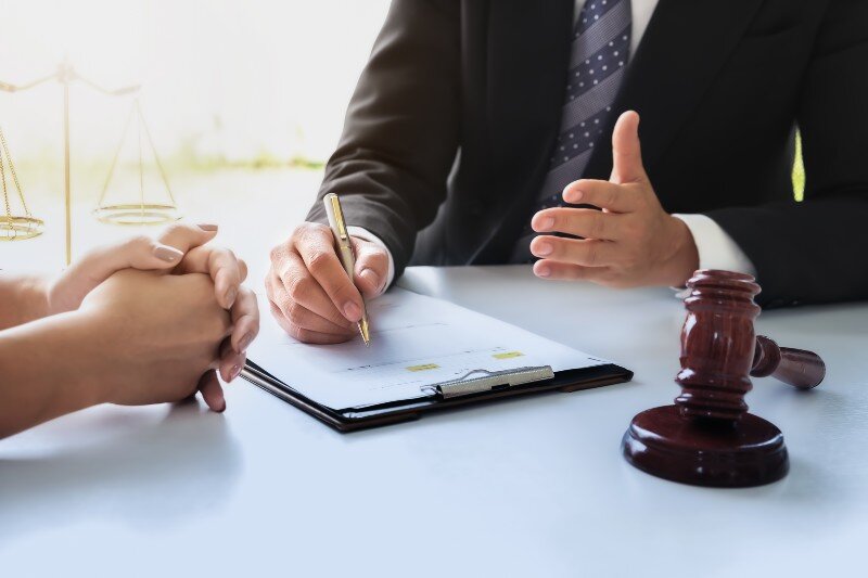 A lawyer assesses a woman and property laws, divorce, and selling a house when getting a divorce.