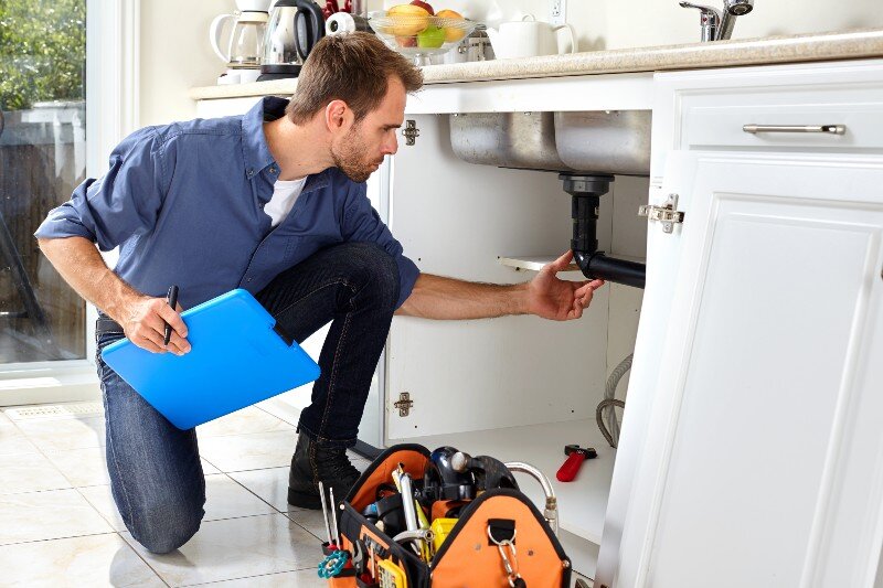 A man goes performs a home inspection for a house appraisal.