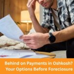 Oshkosh homeowner reviewing mortgage options before foreclosure at kitchen table