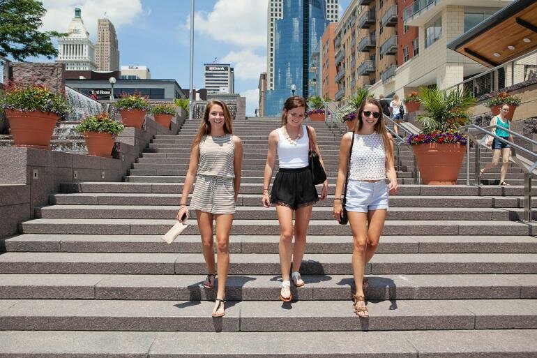 the banks cincinnati - sunshine girls on steps - great place for friends