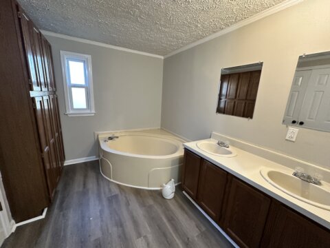 Primary bathroom with garden tub and built in storage in Gilbert, SC