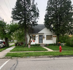 Shingle with white painted wall home for sale in Patton St. Detroit