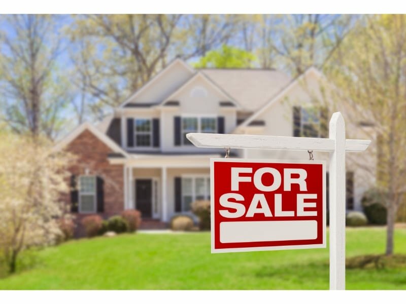 home for sale real estate sign and house