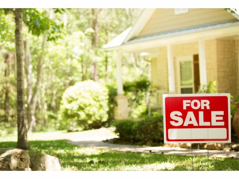 Home for sale with real estate sign
