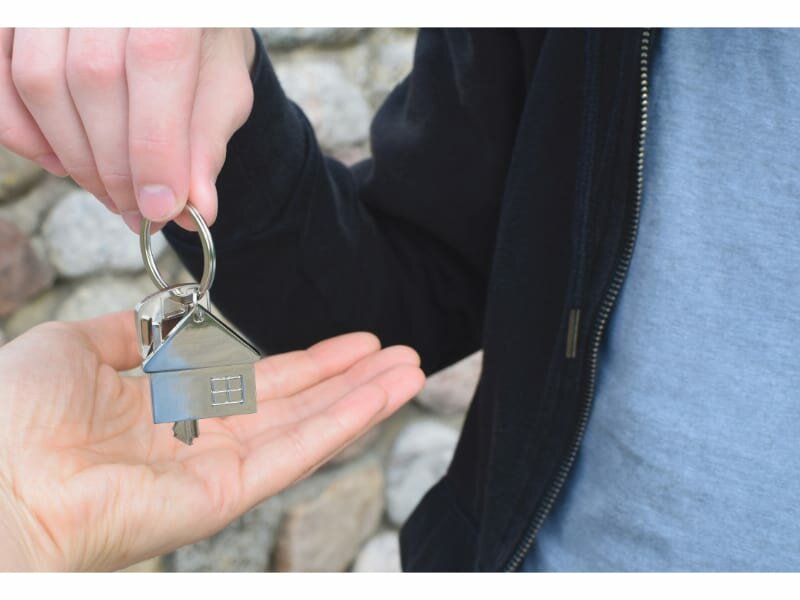 Man handing house keys