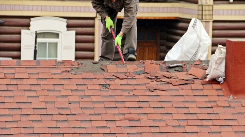 Worker repairing roof