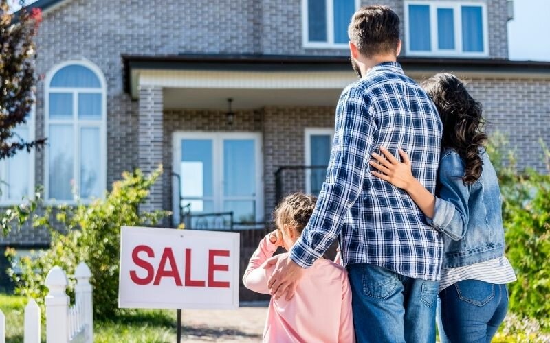 family looking at house on sale