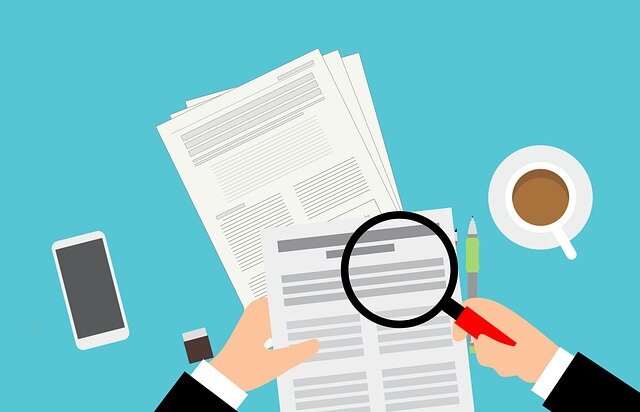 An illustration of a person looking at papers through a magnifying glass.