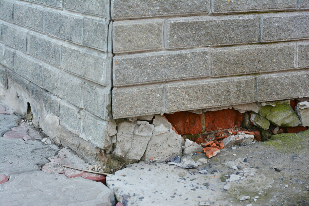 house with a broken foundation pillar
