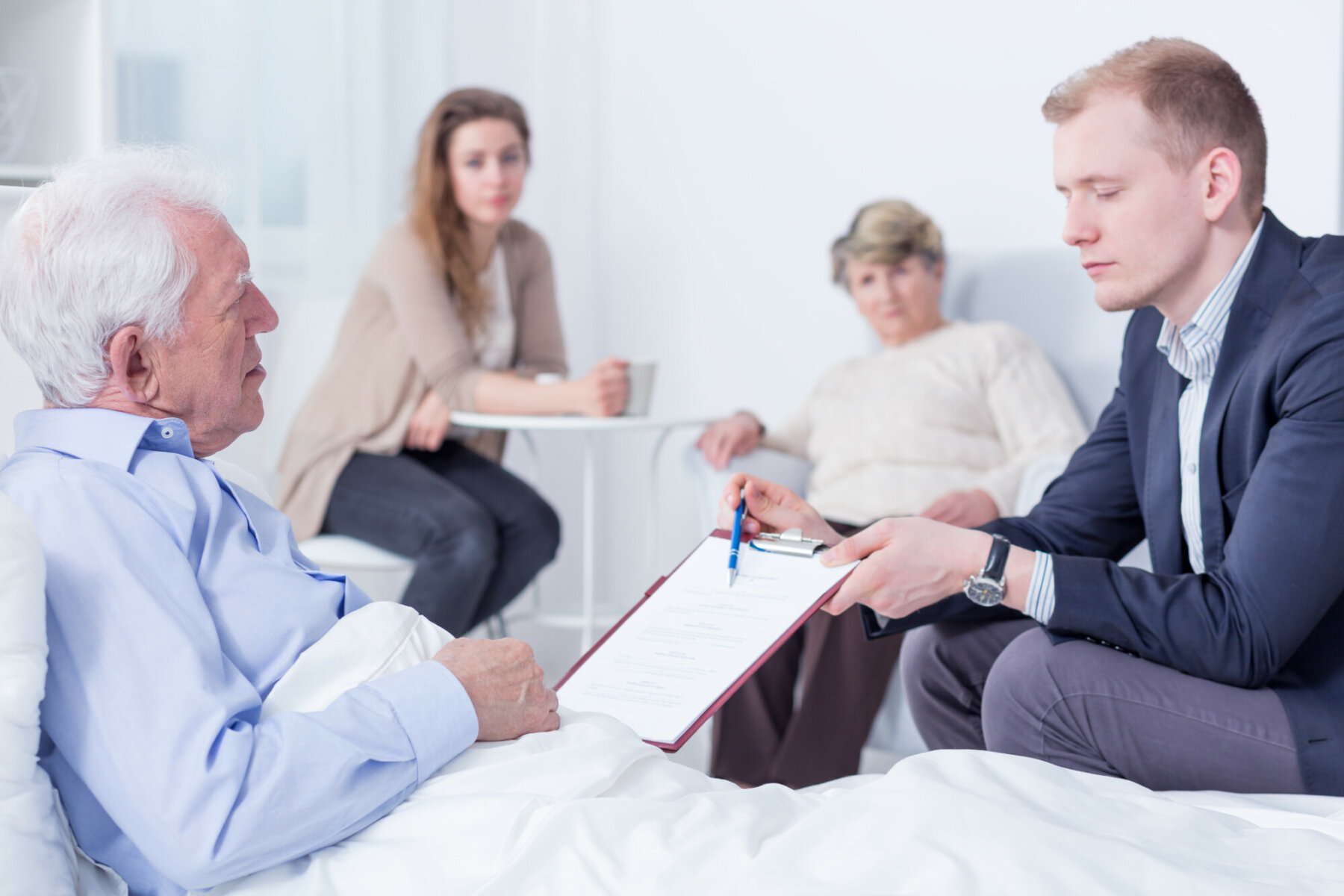 older man reviewing his will with an attorney