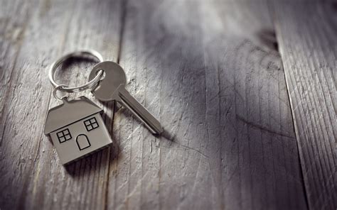 Picture of a key attached to keychain in a house shape