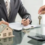 A homeowner selling a house that needs repairs for cash at a real estate closing.