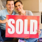 Selling My House Fast in [market_city] | couple holding sold sign