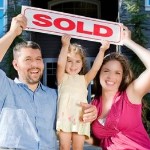 How to sell your House Quickly | white family holding sold sign