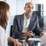 advantages of selling to an investor over a traditional buyer | business meeting