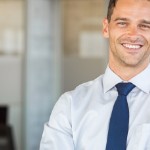 Should I Hire A Real Estate Agent To Sell My Home | smiling white businessman