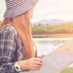 Why Selling Land Is Different Than Selling Your House | woman with map sunset