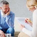 Selling Psychology | man smiling woman writing