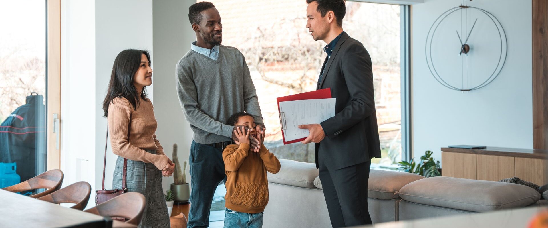 A family talking to a real estate agent
