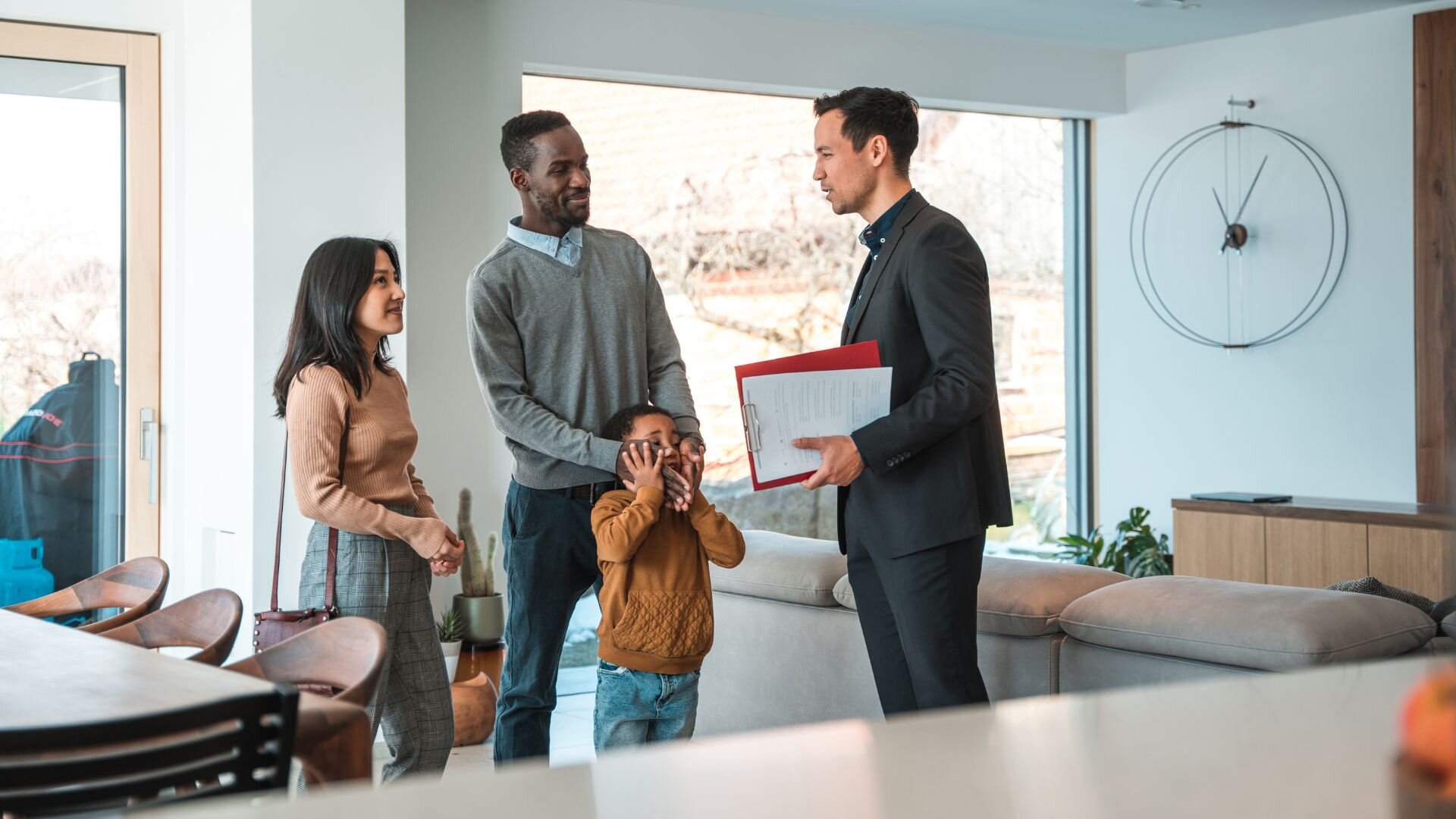 A family talking to a real estate agent