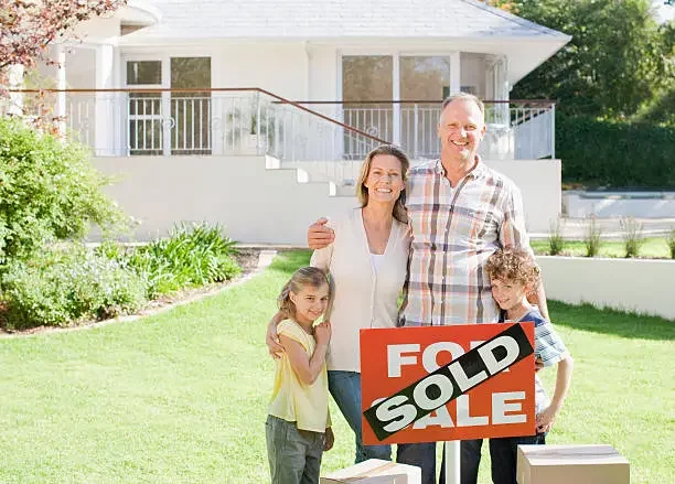 Family holding sold sign symbolizing a fast cash as-is sale. Sell my house fast San Lorenzo CA