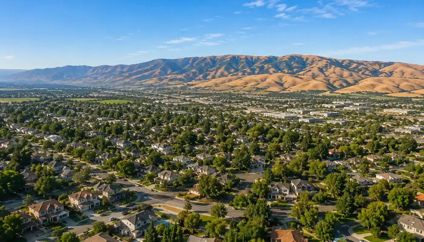 Aerial hero image of Livermore CA neighborhoods with the Altamont Pass hills in the background for a sell my house fast cash home buyers