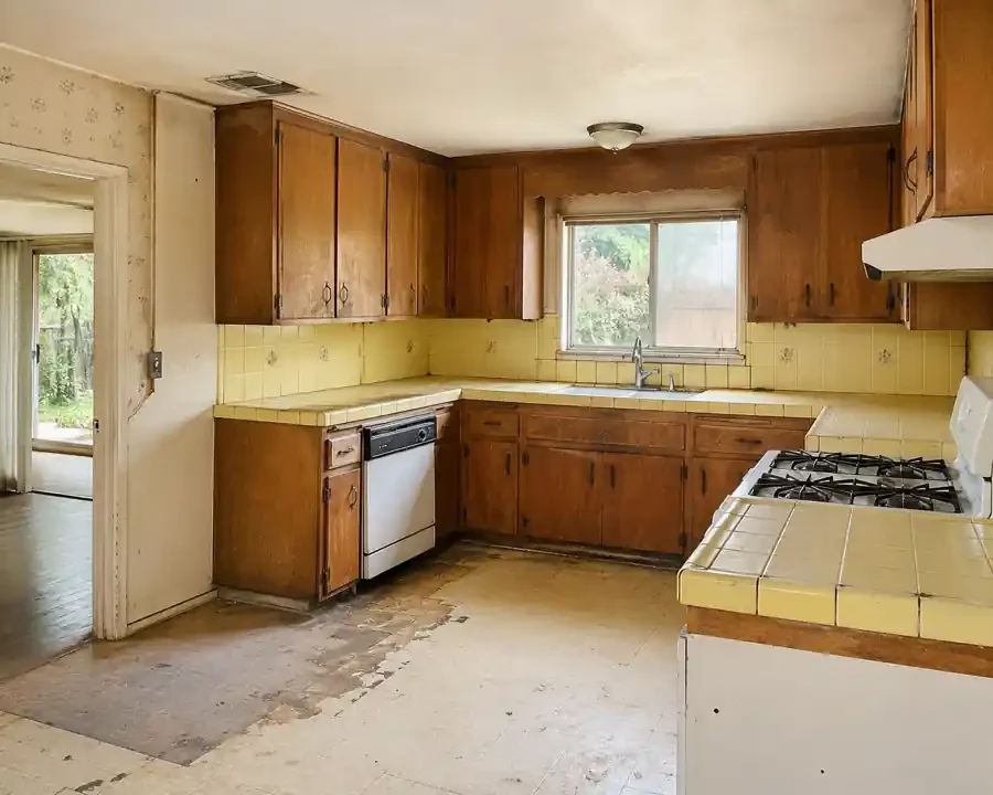 Dated fixer upper kitchen in Carmichael CA showing an older home condition often purchased by local we buy houses cash buyers and cash home buyers for as is sale opportunities