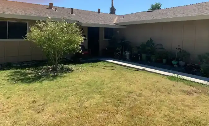 Front exterior of a tenant-occupied rental property on Mary Lou Way in Sacramento, California, purchased and renovated by R&H Distressed Properties.
