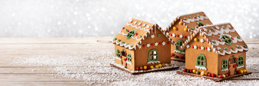 three decorated gingerbread houses