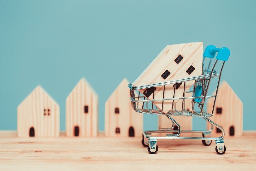 Buy home shopping sale wood house with cart or shop new house promotion accommodation mortgage and loans concept.