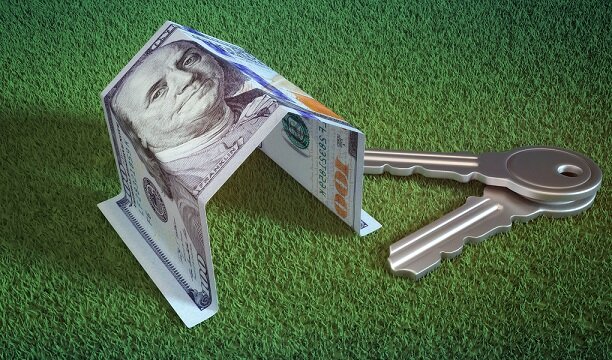 Mortgage, investment, real estate and property concept. Dollar money and house keys