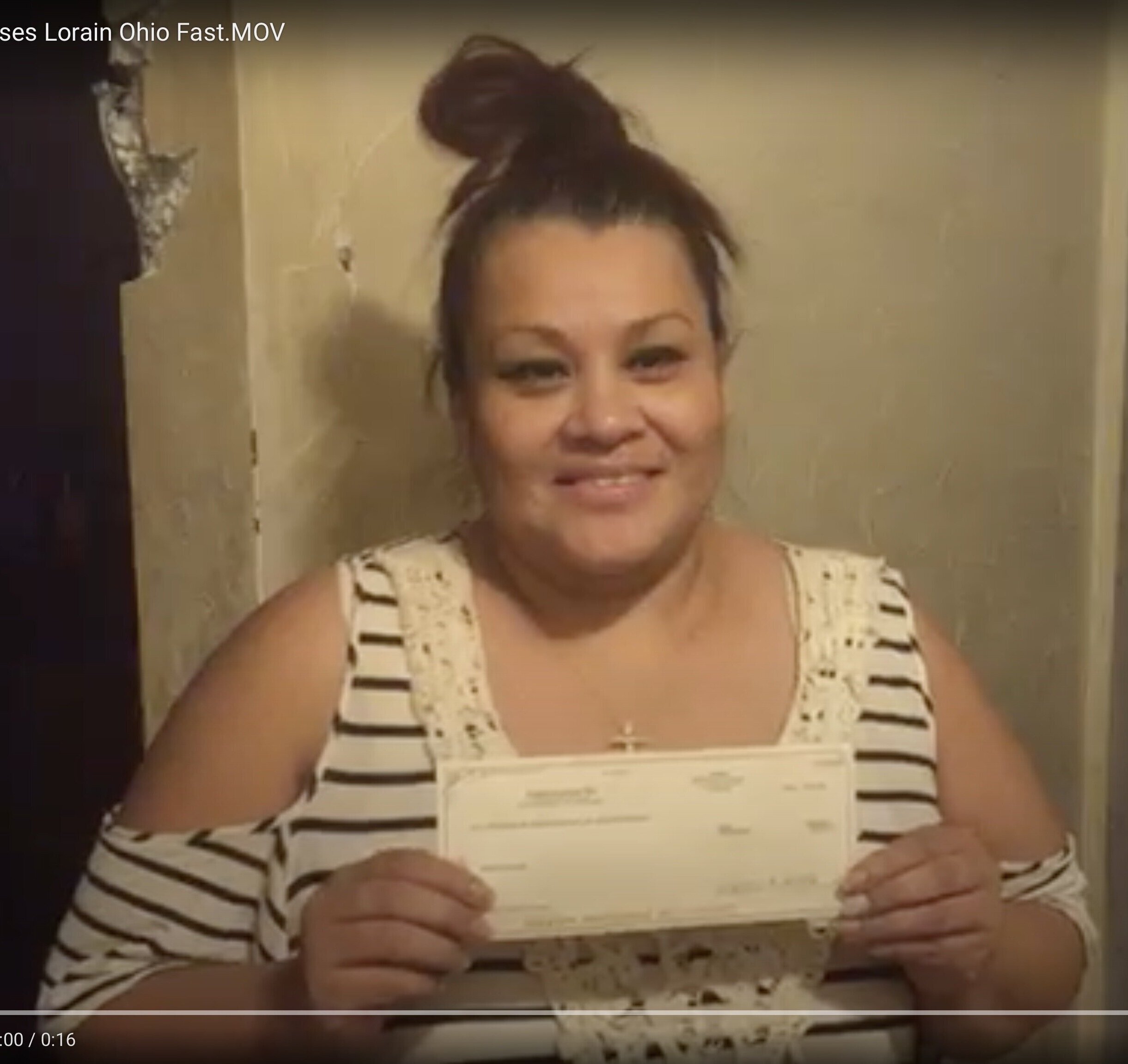 Happy Customer receives her check for her house in Lorain Ohio