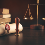 lawyer scales, official documents and a wax seal on a wooden table