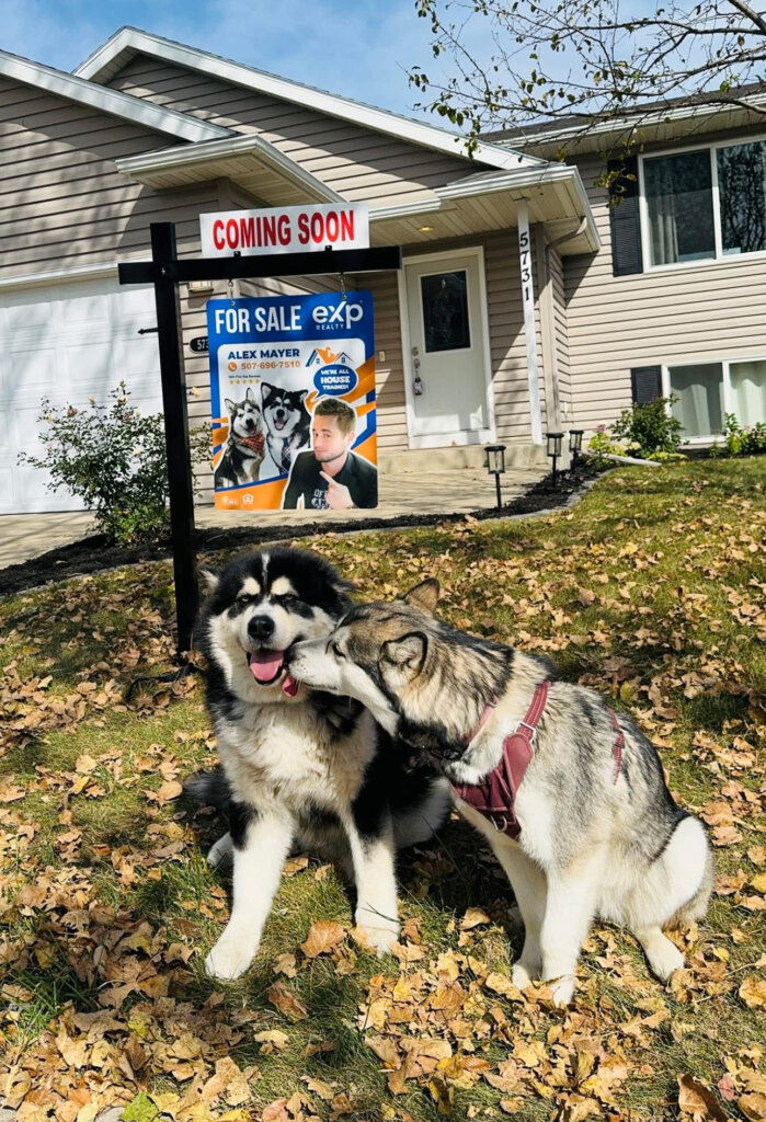 Atlas and Kaia outside a listing.