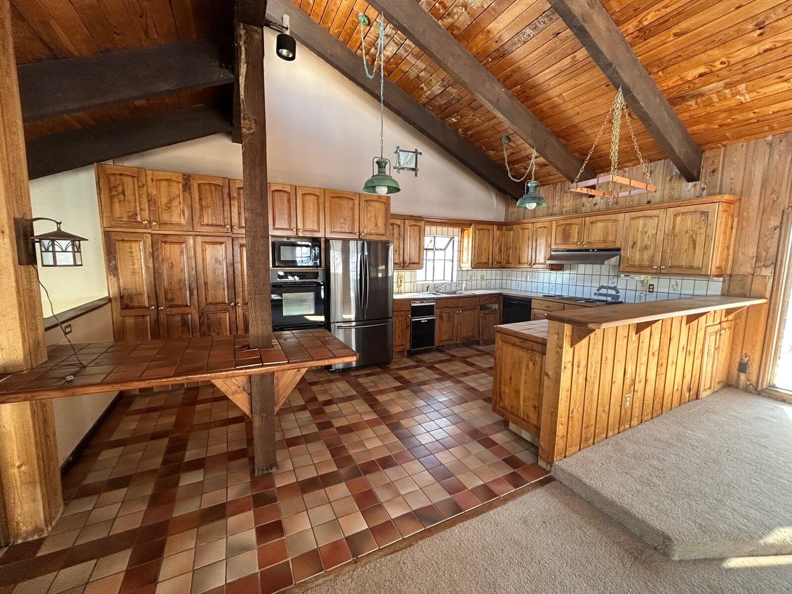 dated original wood kitchen at our 2950 Juilliard St house in Boulder before the gut rehab