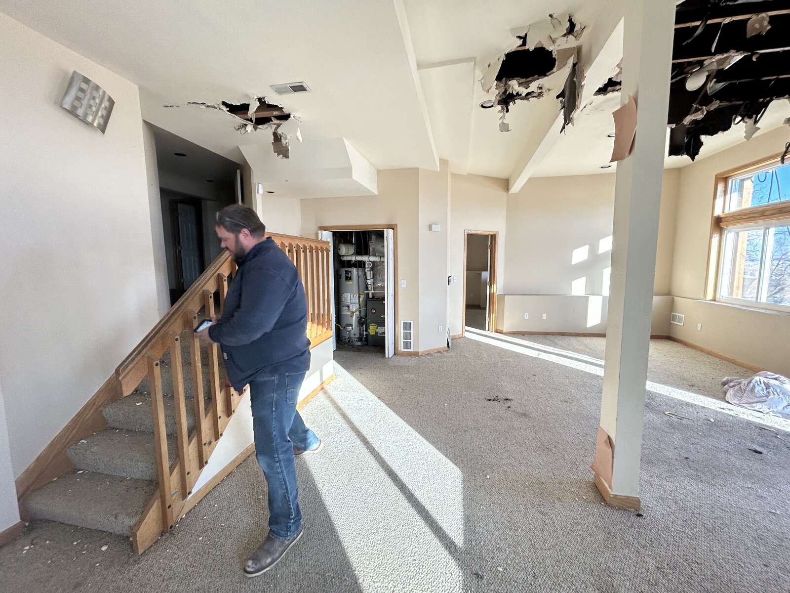 Fire-damaged family room with opened ceilings at 816 Trail Ridge in Louisville on purchase day