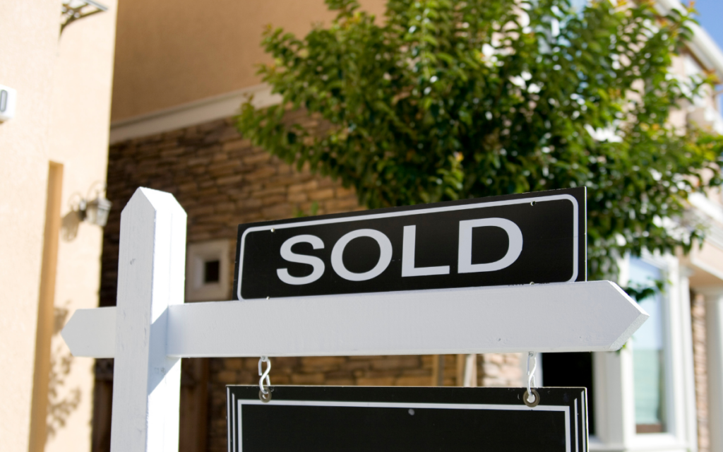 Stock photo of a black and white "sold" sign