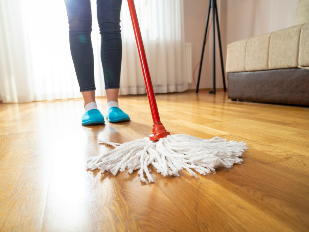 Someone mopping a hardwood floor