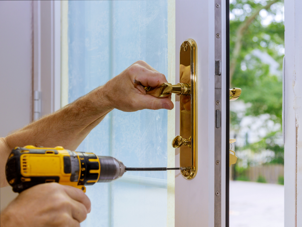 A man replacing a door handle