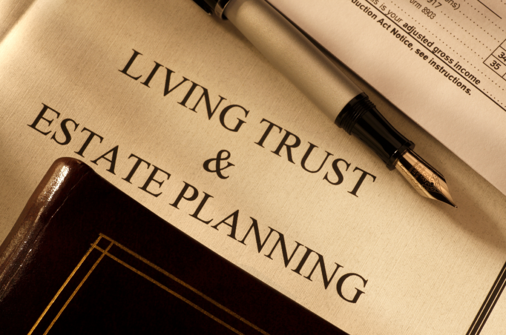 Stock image for avoiding probate court: a legal document titled "Living Trust & Estate Planning," beside a pen, notebook, and financial documents.
