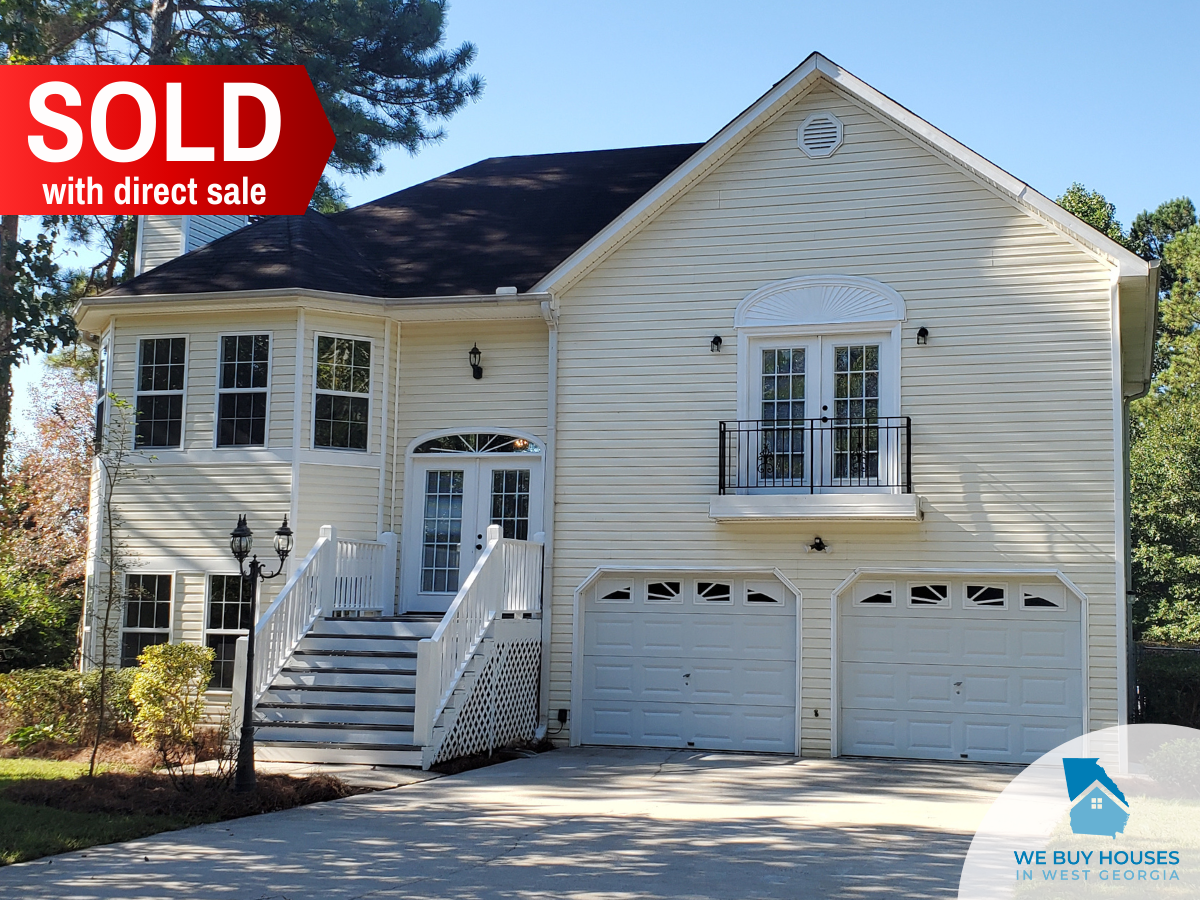 A white two-story house purchased through direct sale by We Buy Houses in West Georgia