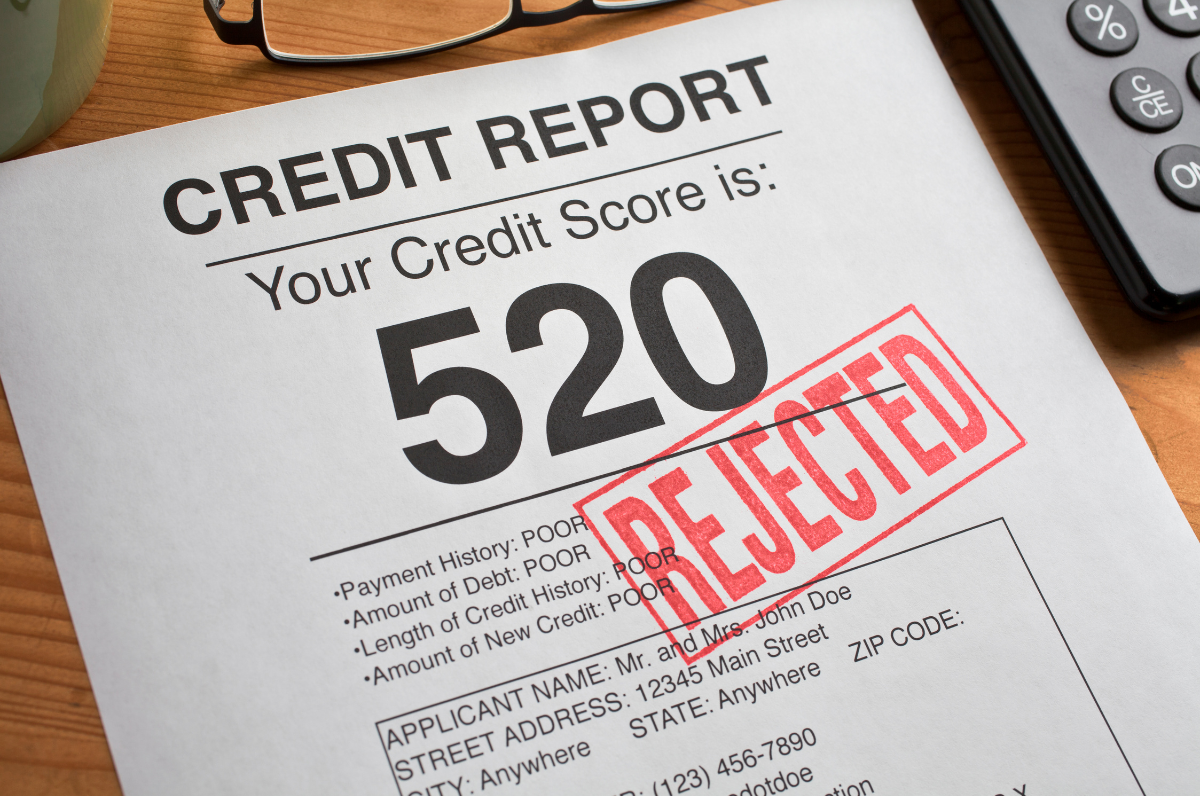 Image of a credit report with a low credit score that has been rejected for a loan request.